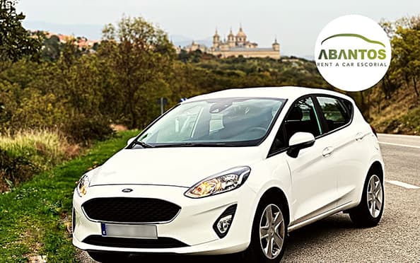 alquiler-de-coches-en-la-sierra-de-madrid-ford-escorial-fondo-min